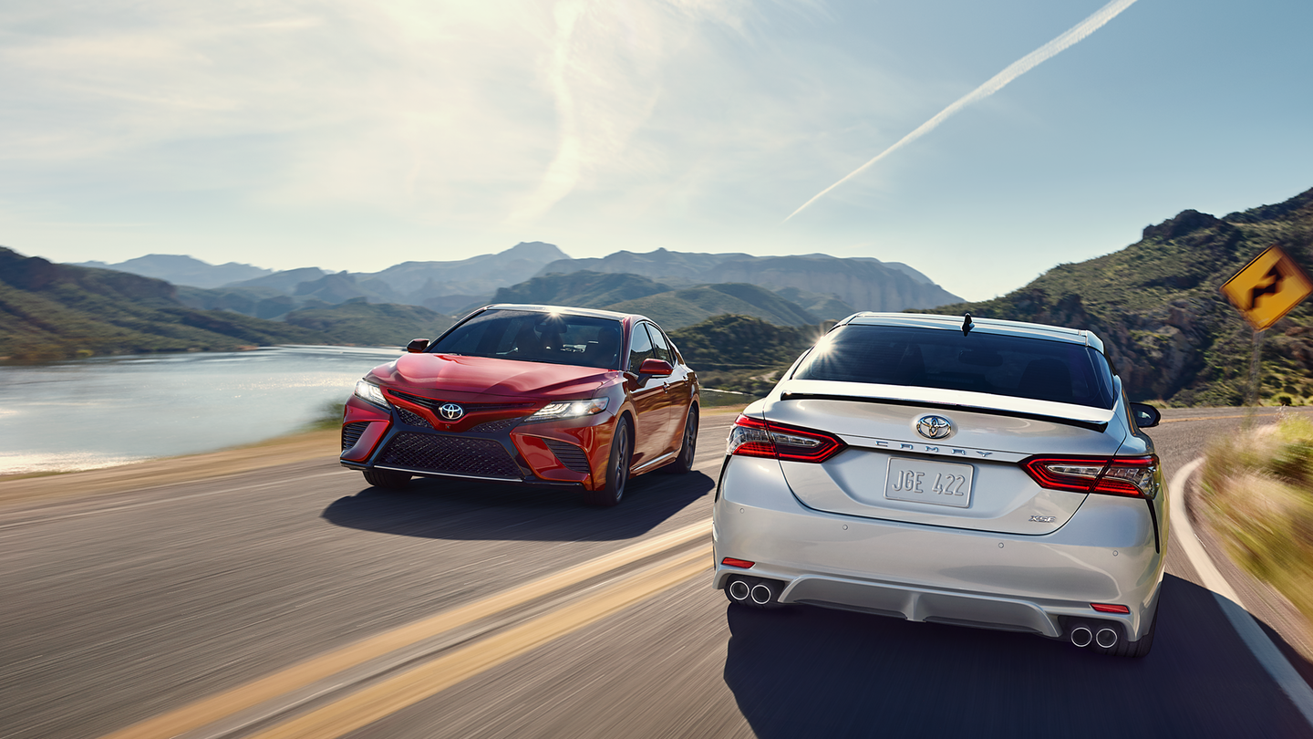 2018 Toyota Camry White Rear Exterior Red Front Exterior.png
